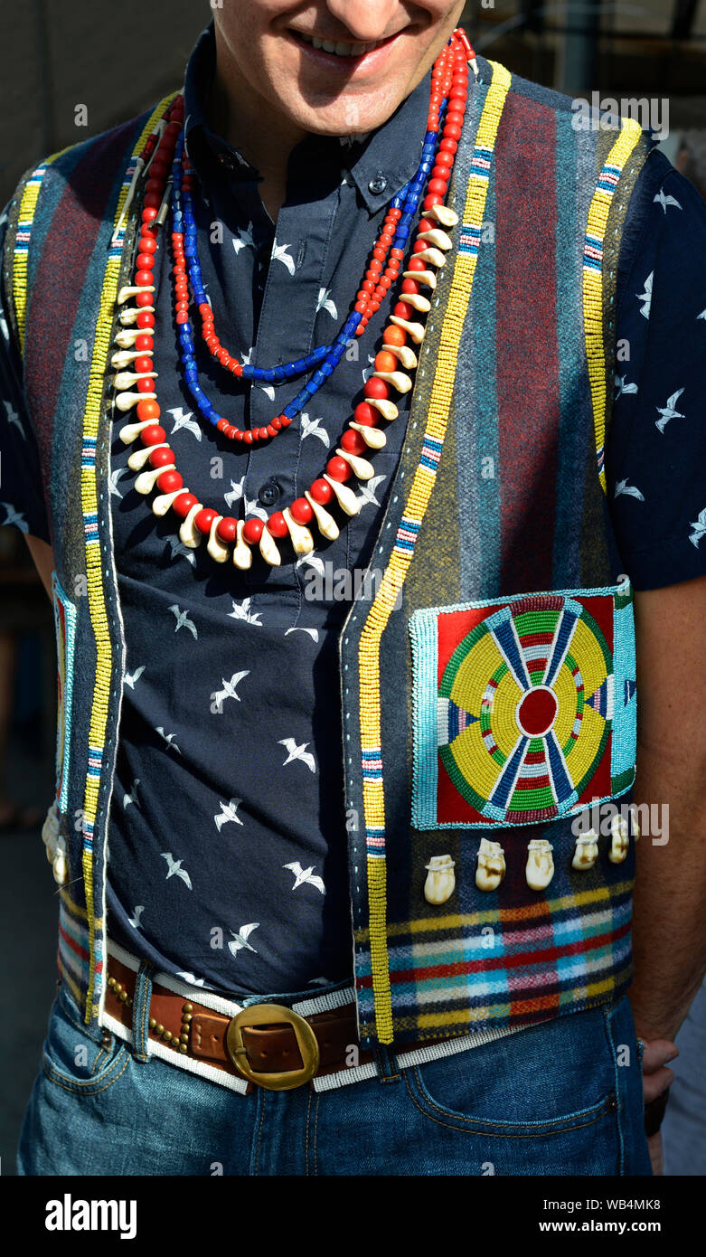 A man wearing a beaded Native American vest visits the Santa Fe Indian  Market in New Mexico, USA Stock Photo - Alamy