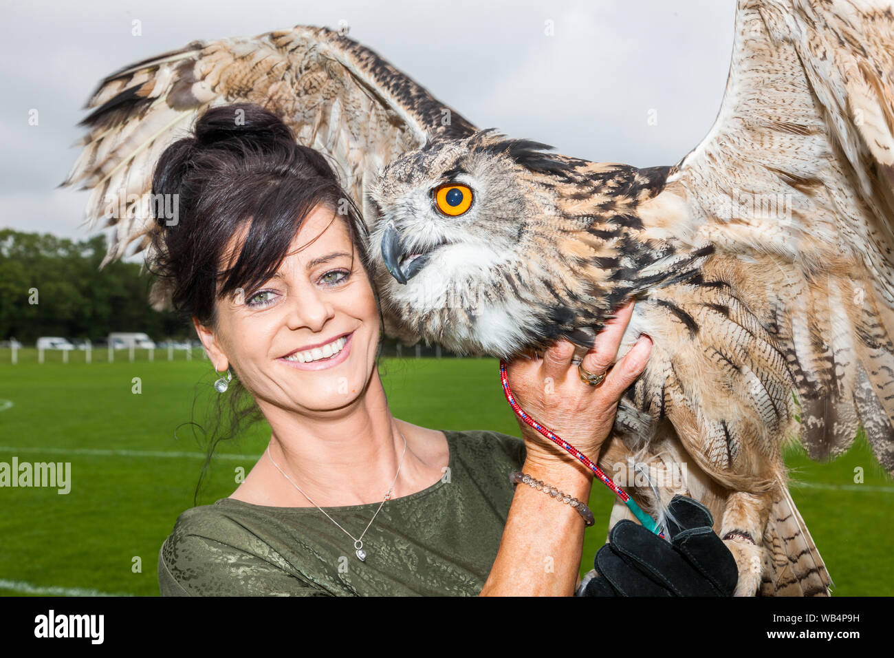 Ballygarvan, Cork, Ireland. 24th August, 2019. Jolanta Proc from Riverstick, with her Eagle Owl Fifi at the agricultural show that was held at Ballygarvan, Co. Cork, Ireland.- Credit; David Creedon / Alamy Live News Stock Photo