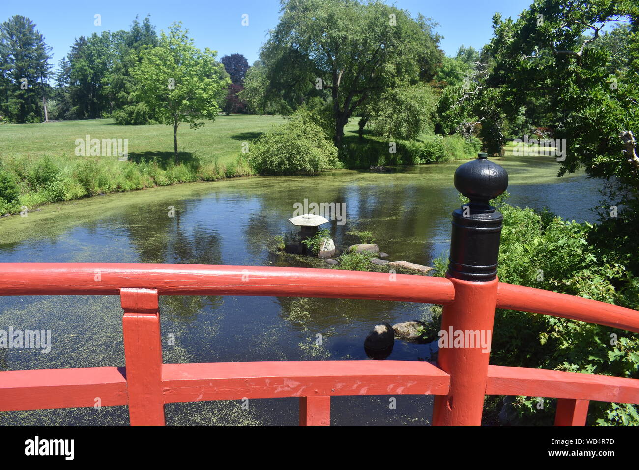 Red wooden bridge in a Japanese meditation garden at Duke Farms, Hillsborough, New Jersey -02 Stock Photo