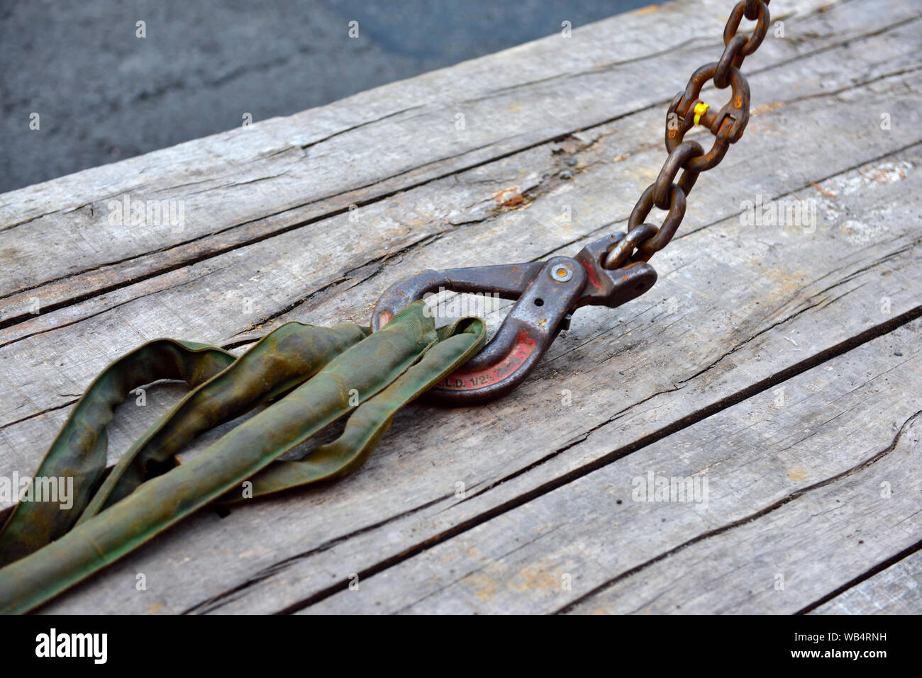 Heavy lifting crane hook with closed safety catch hooked onto lifting