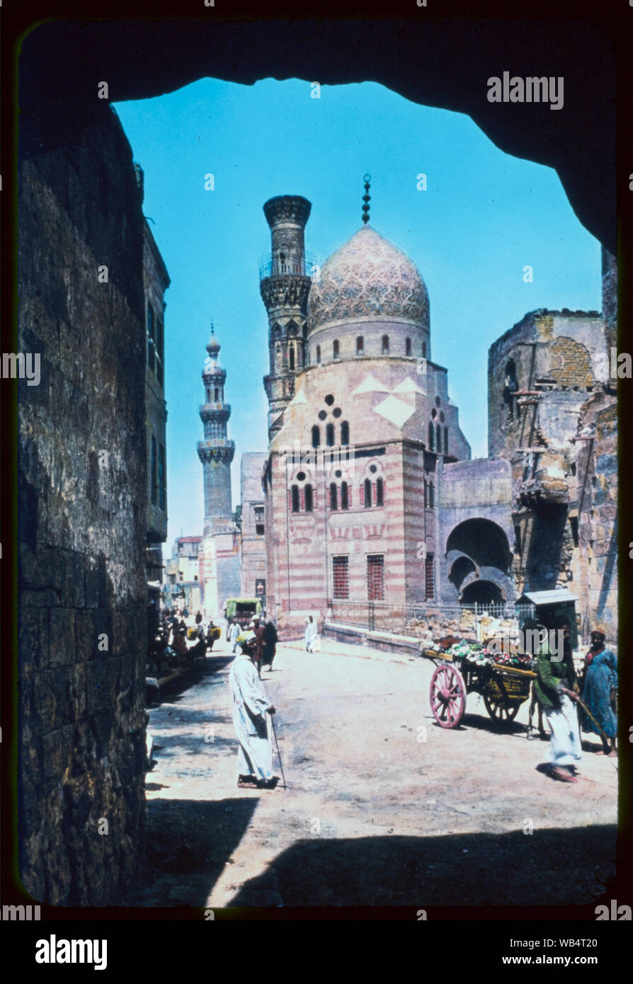 Egypt. Cairo. Cairo street scene and Mosque of Kait Bey Abstract/medium: G. Eric and Edith Matson Photograph Collection Stock Photo