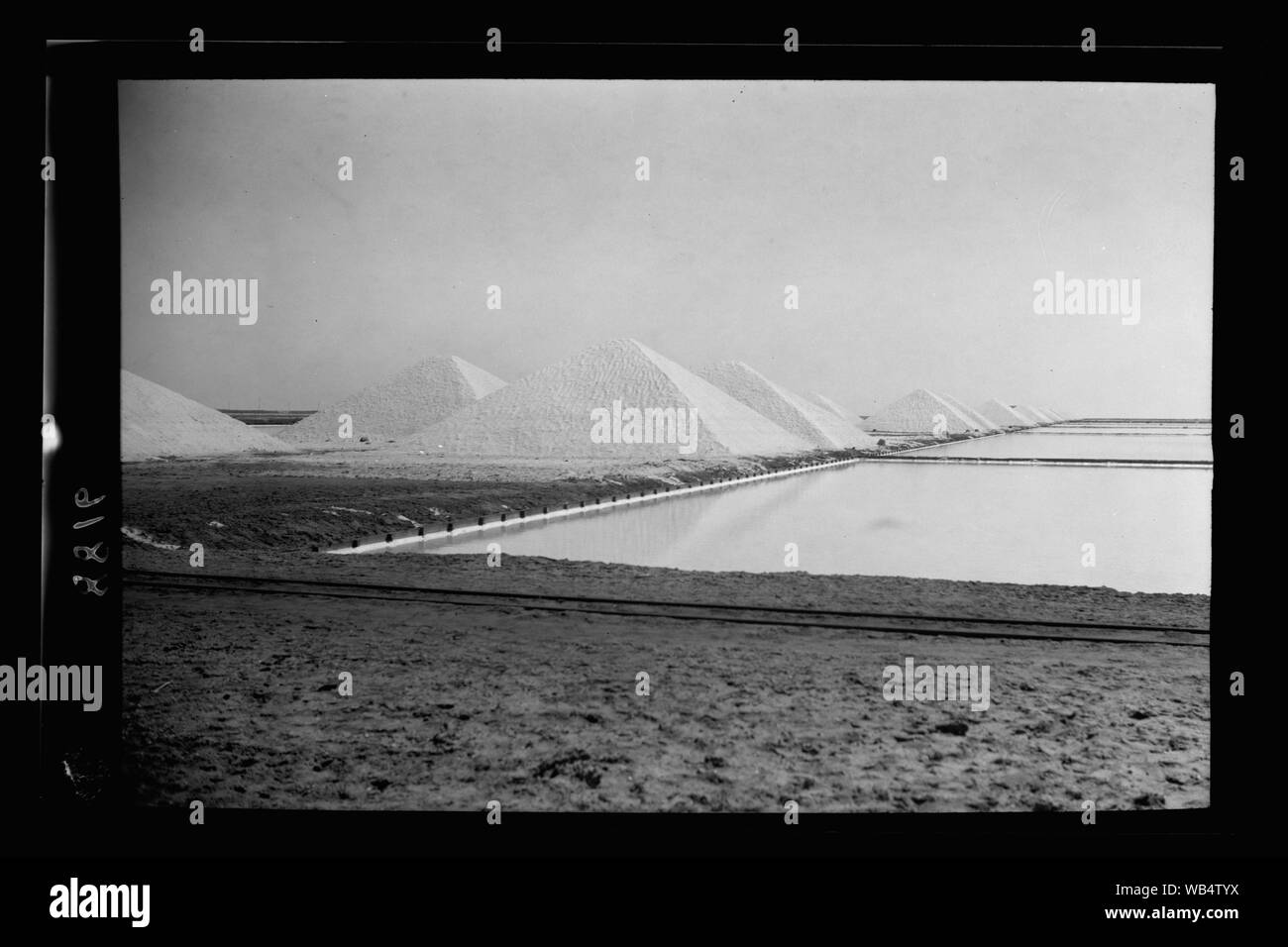 Egypt. Port Said. So. east salt works. Piles of salt in pyramid form