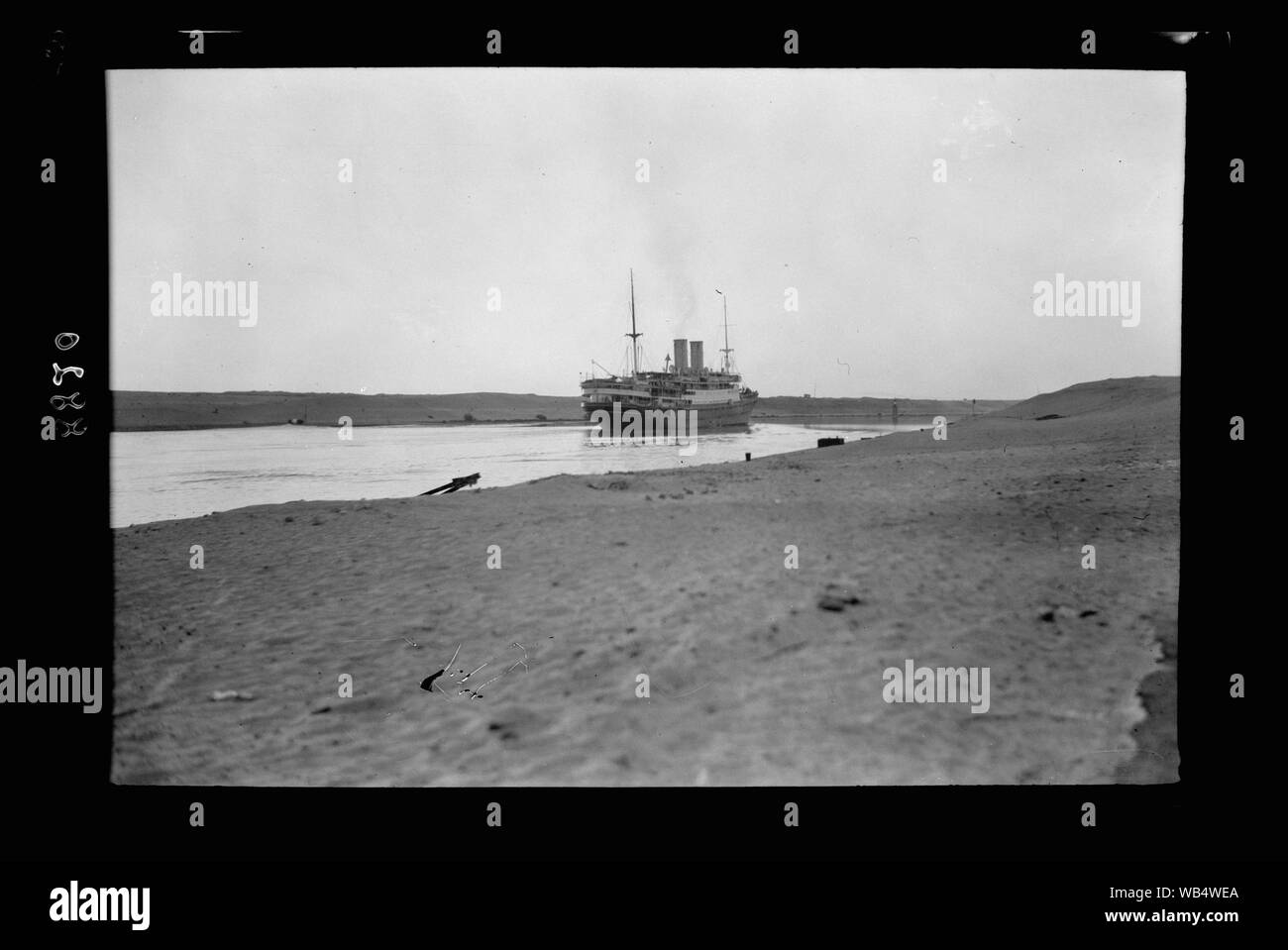 Egypt. Suez Canal. Ship passing thro[ough] Canal Abstract/medium: G. Eric and Edith Matson Photograph Collection Stock Photo