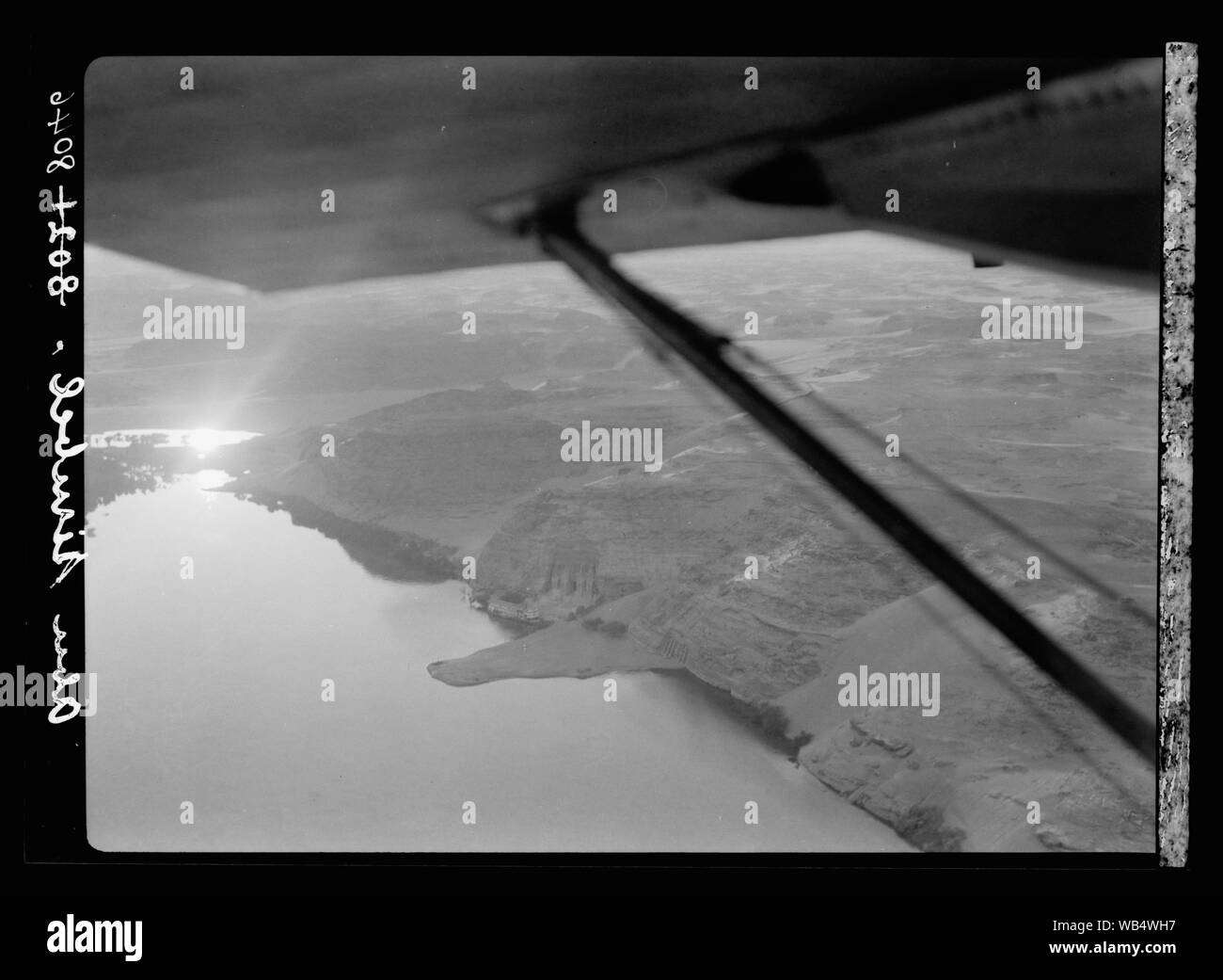 Egypt. Thebes to southern border of Egypt. Air view. Abou Simbel showing monuments by river's edge, setting sun reflected in river Abstract/medium: G. Eric and Edith Matson Photograph Collection Stock Photo