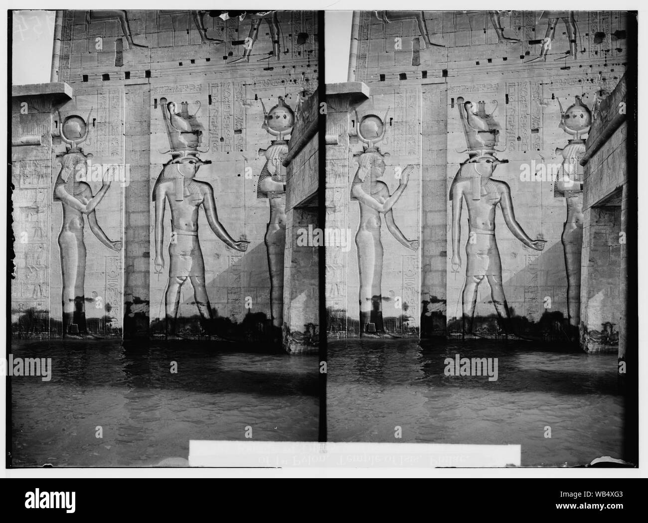 Egyptian views; Assuan and Philae. Reliefs of different deities on wing of 1st pylon Abstract/medium: G. Eric and Edith Matson Photograph Collection Stock Photo
