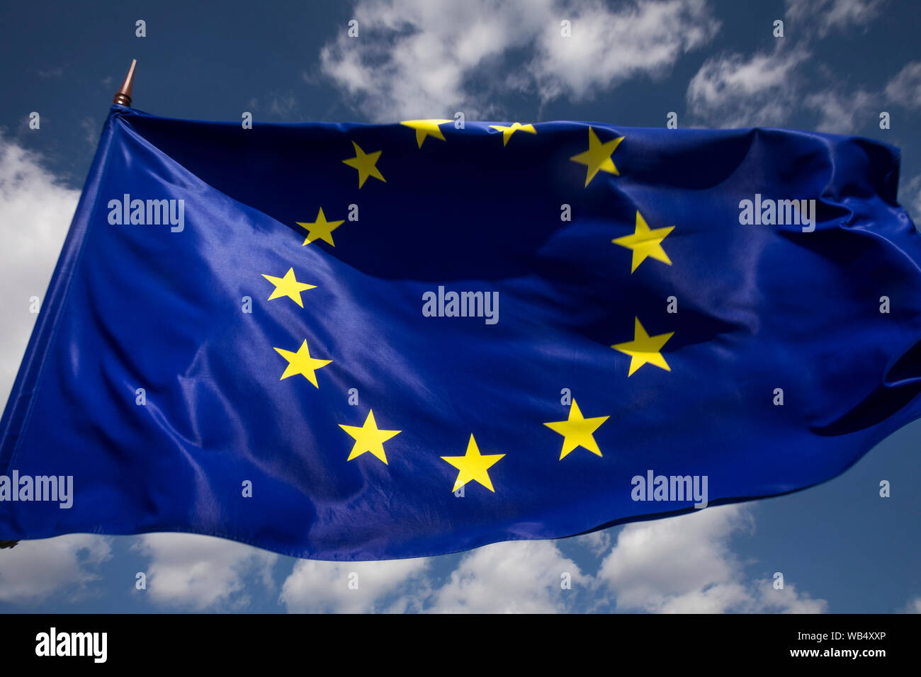 View of European Union EU flag on blue sky background Stock Photo