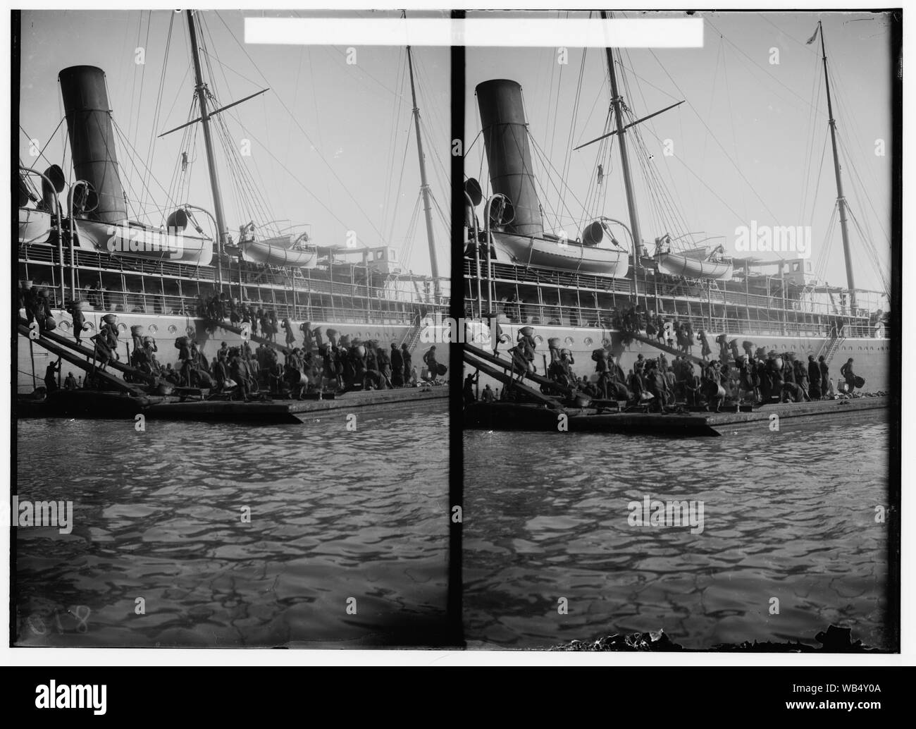 Egyptian views; Port Said. Natives coaling a steamer at Port Said Abstract/medium: G. Eric and Edith Matson Photograph Collection Stock Photo