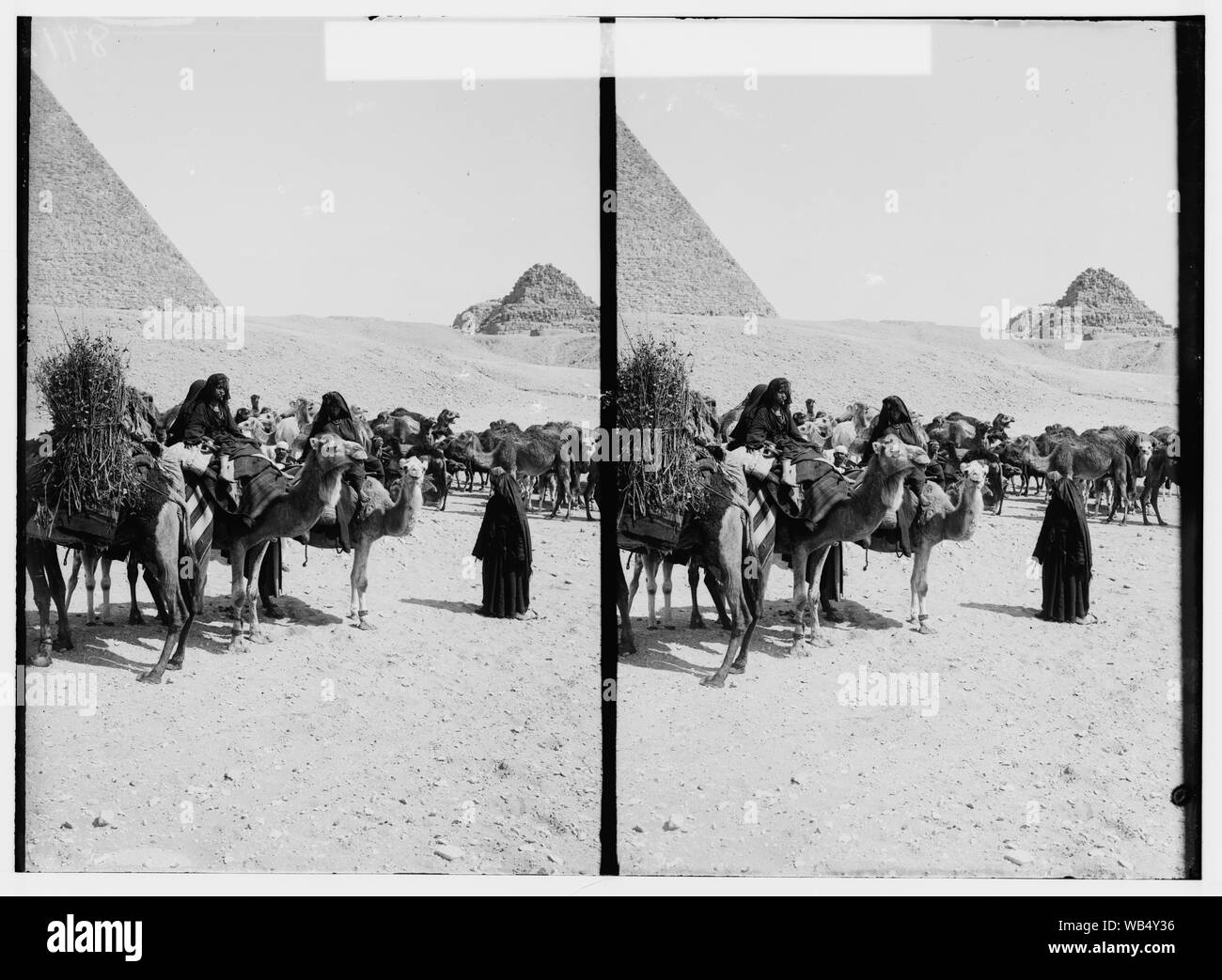 Egyptian views; The pyramids of Gizeh. Caravan of Bedouins arriving at pyramid Abstract/medium: G. Eric and Edith Matson Photograph Collection Stock Photo