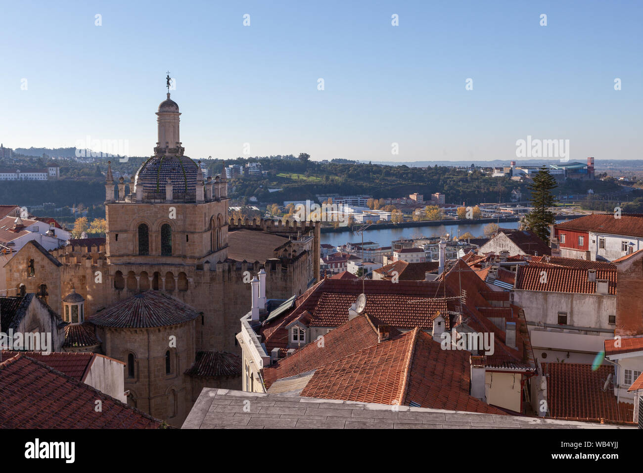 A panoramic view of the city of Coimbra with Sé Velha de Coimbra ( the Old Cathedral) overlooking the Rio Mondego - Portugal. Stock Photo