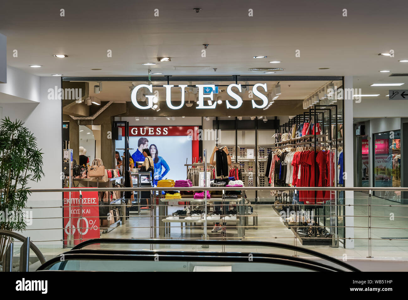 Guess outlet retailer store interior. Clothing brand store with prices at MEGA Outlet shopping mall in Thessaloniki Greece Stock Photo - Alamy