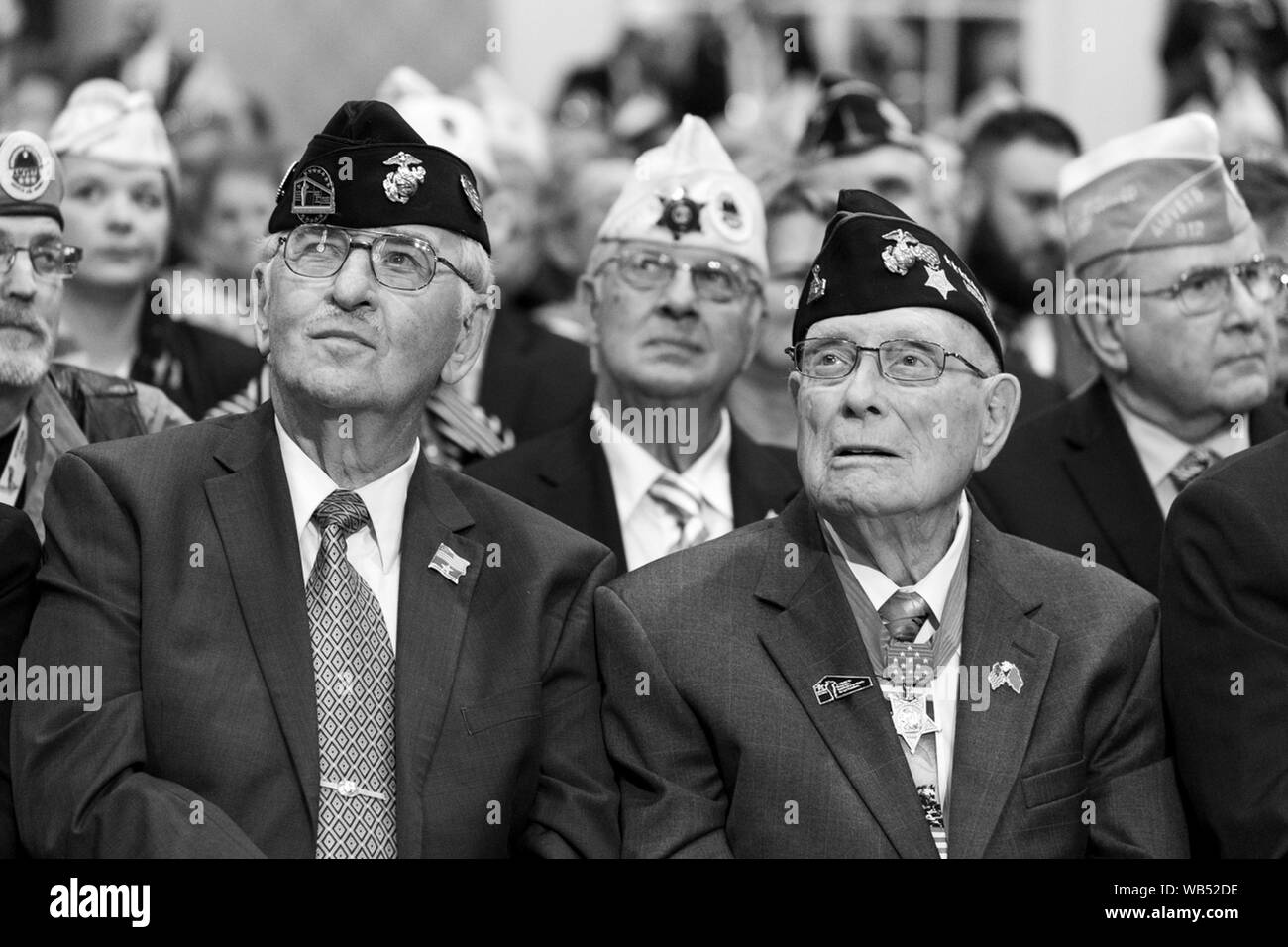 Louisville, United States Of America. 21st Aug, 2019. Veterans listen as President Donald J. Trump delivers remarks at the American Veterans (AMVETS) 75th National Convention prior to signing a Presidential Memorandum 'Discharging the Federal Student Loan Debt of Totally and Permanently Disabled Veterans' Wednesday, Aug. 21, 2019, at The Galt House Hotel in Louisville, Ky People: President Donald Trump Credit: Storms Media Group/Alamy Live News Stock Photo