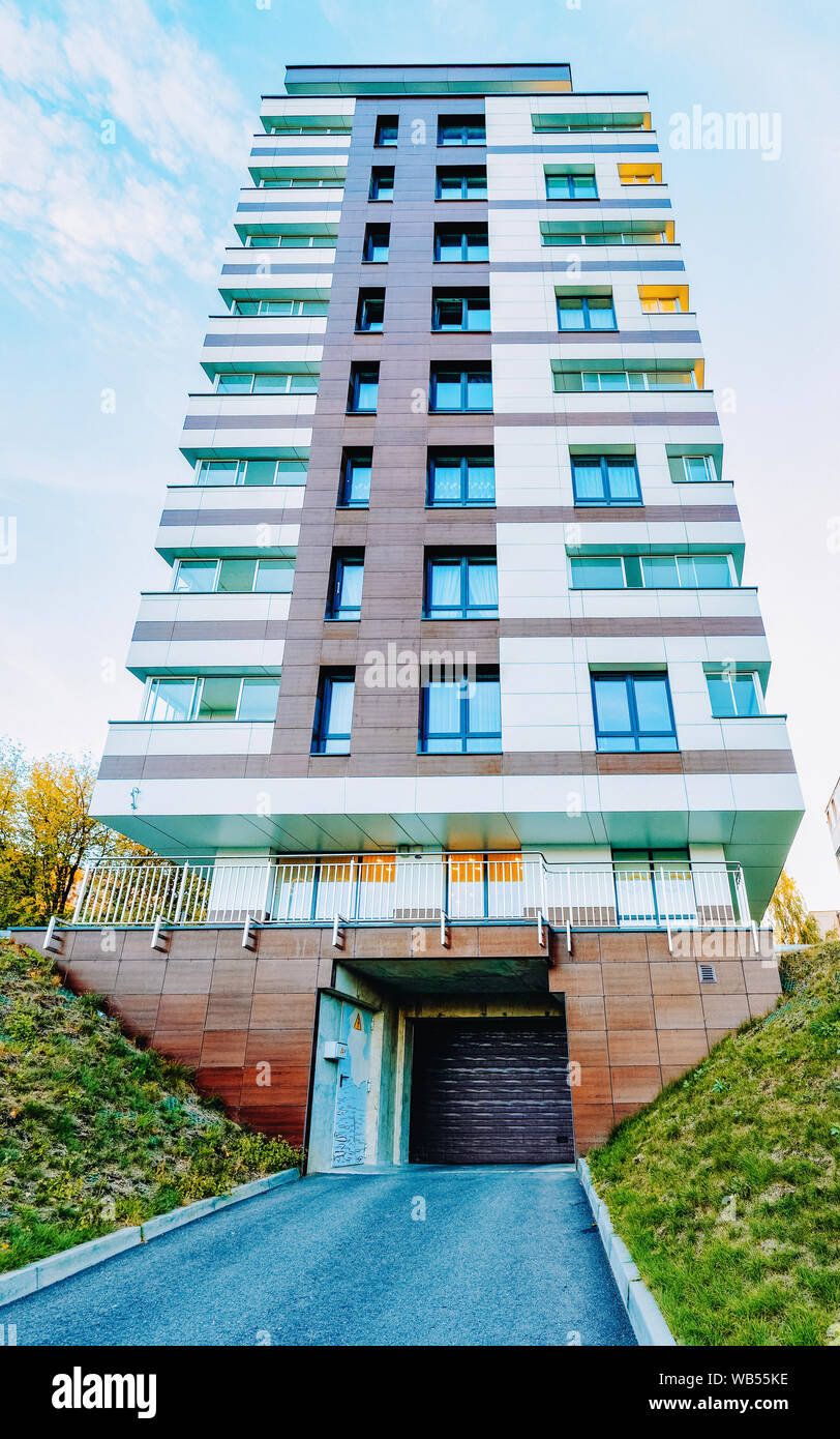 View of EU Modern residential apartment house building and garage and parking ...