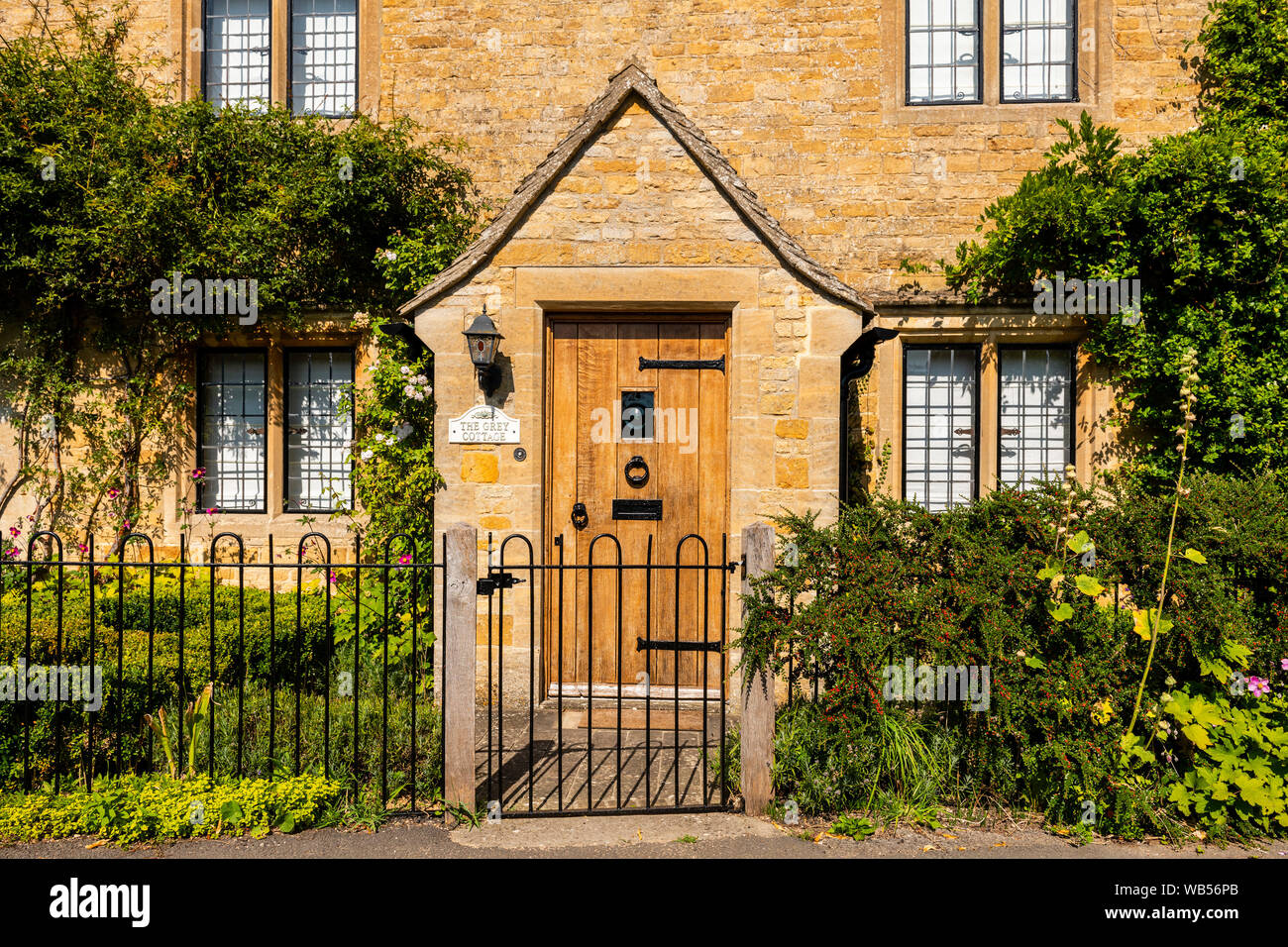 Front door on a Cotswold stone cottage, UK. Stock Photo