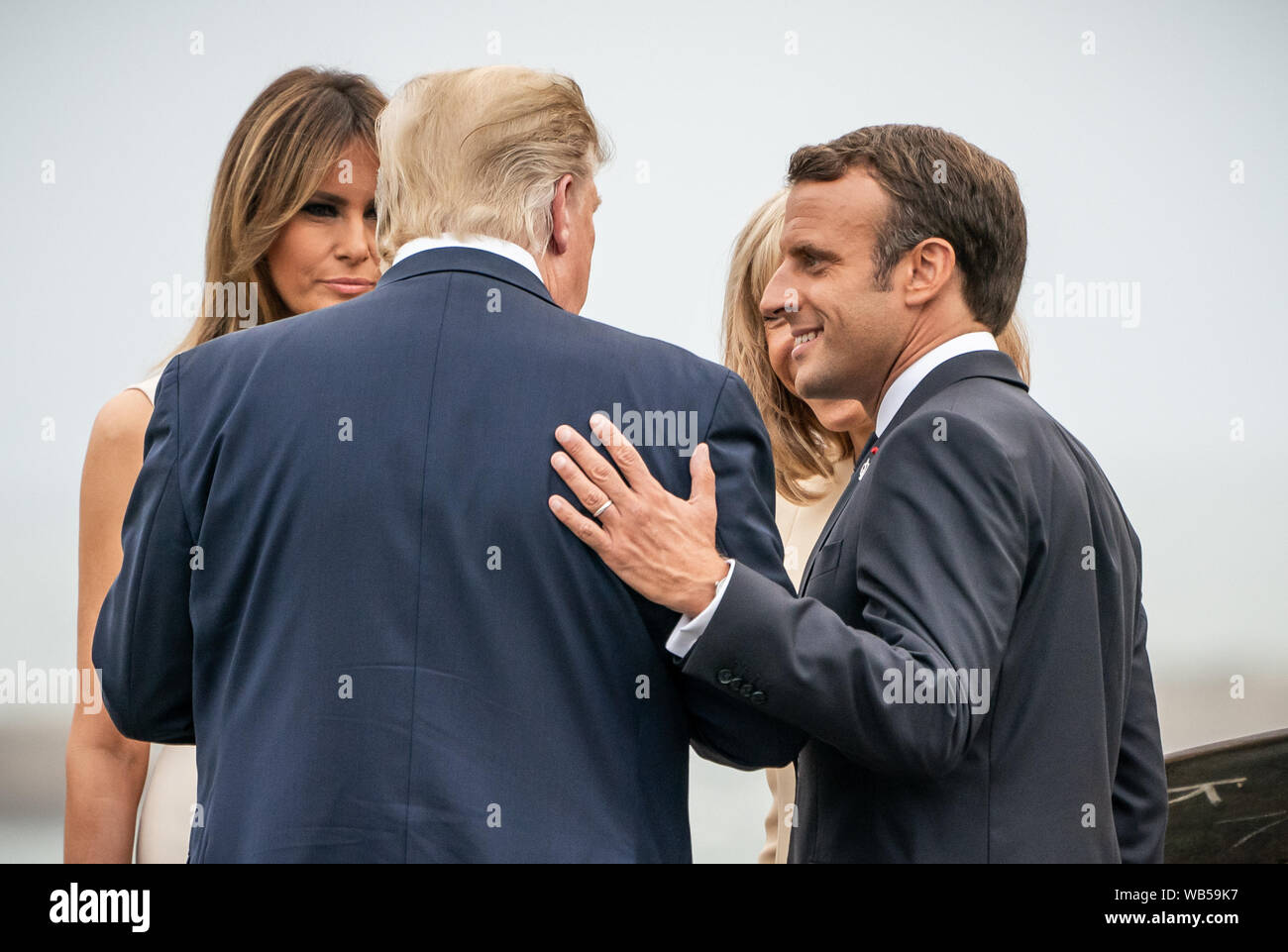 24 August 2019, France (France), Biarritz: France's President Emmanuel Macron speaks with his wife Brigitte, US President Donald Trump, and his wife Melania (l) at the lighthouse. The G7 summit will take place from 24 to 26 August in Biarritz. Photo: Michael Kappeler/dpa Stock Photo