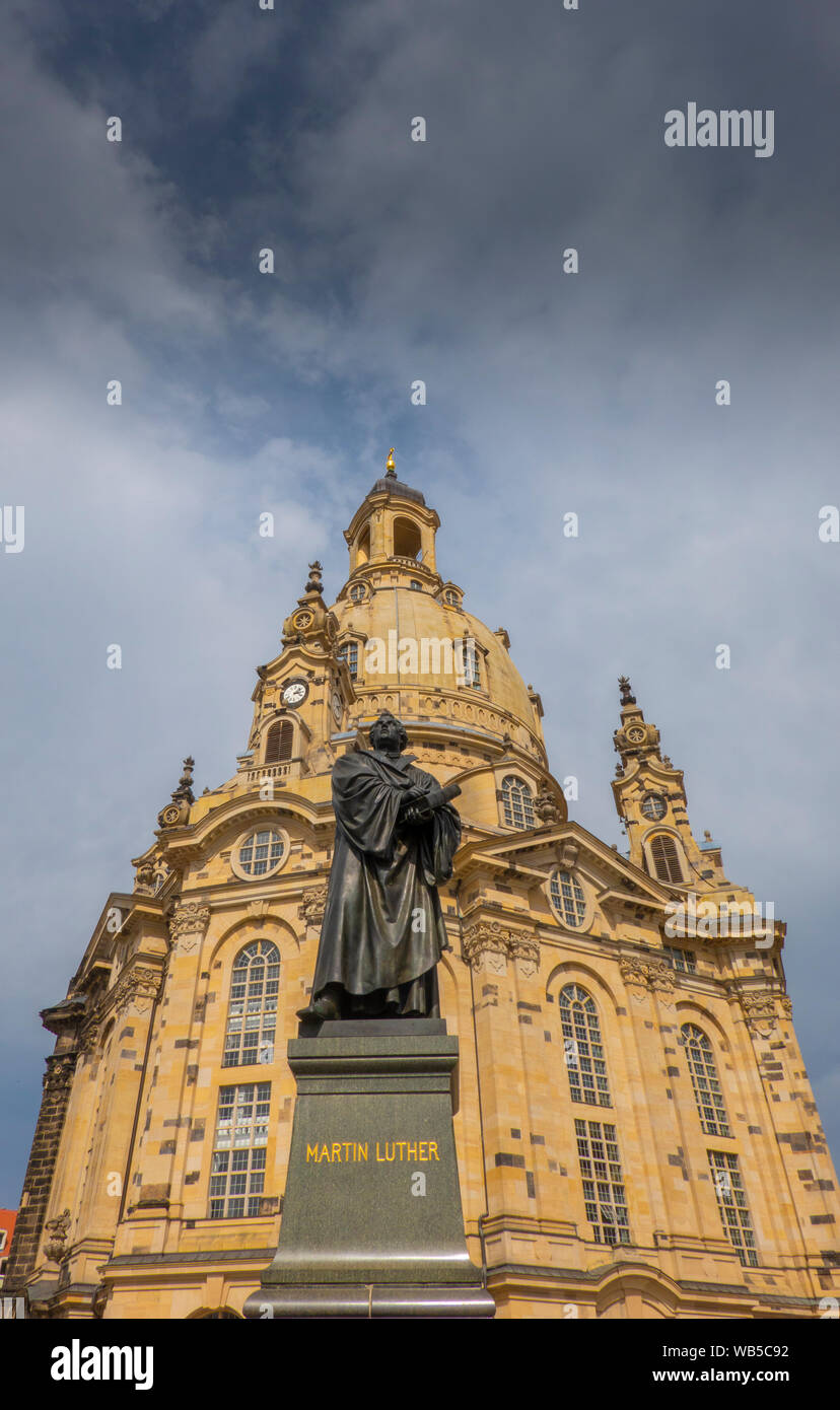 Dresden, Saxony, Germany. State of reformer Martin Luther in front of the Frauenkirche which which was rebuilt after the II. World War Stock Photo