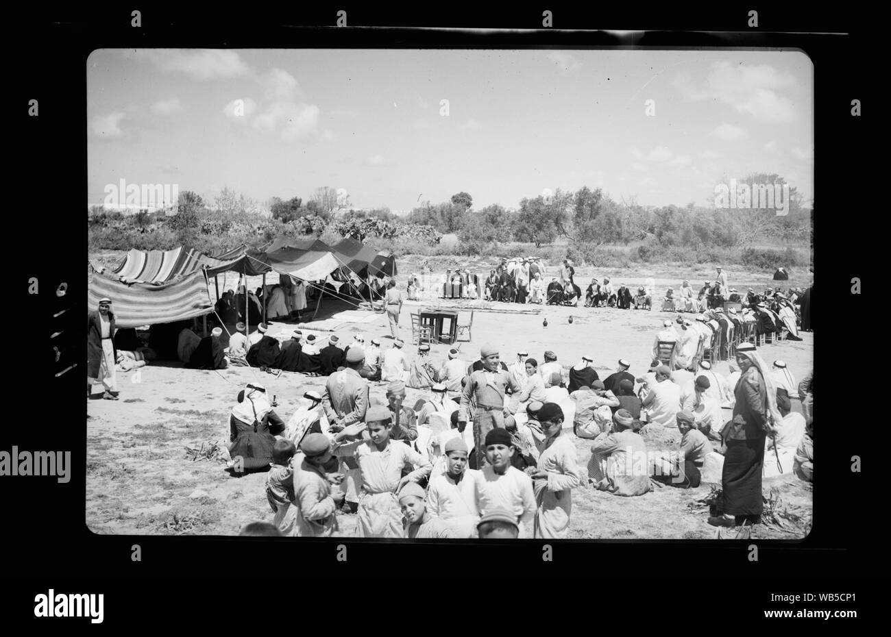 End of a blood feud at el Hamani Village near Mejdal on April 20, '43. Villagers gathered before tent of the judges and 'jury' Abstract/medium: G. Eric and Edith Matson Photograph Collection Stock Photo