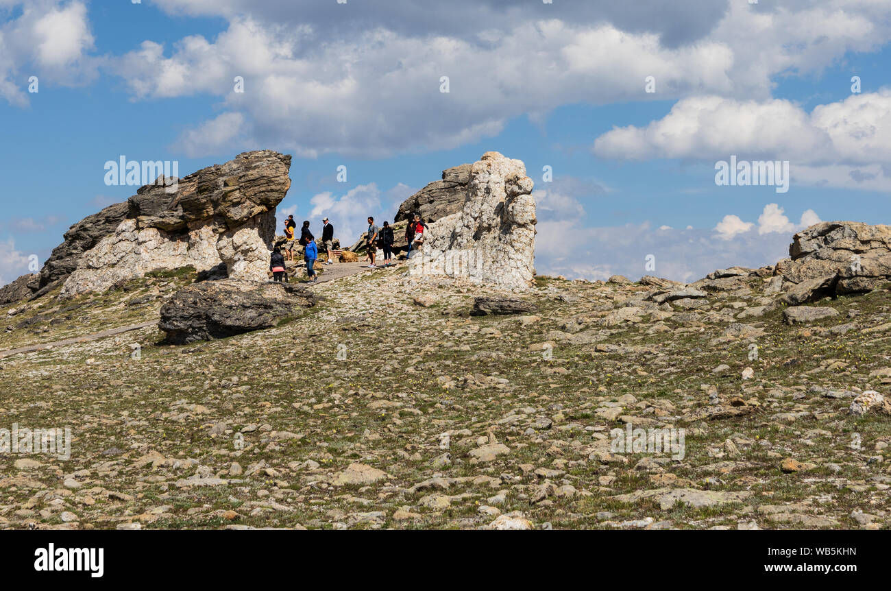 GRAND LAKE, CO, USA-17 JULY 2018:  Above the treeline in Rocky Mtn. National Park, visitors prepare for the hike down to their cars.  Elevation here i Stock Photo