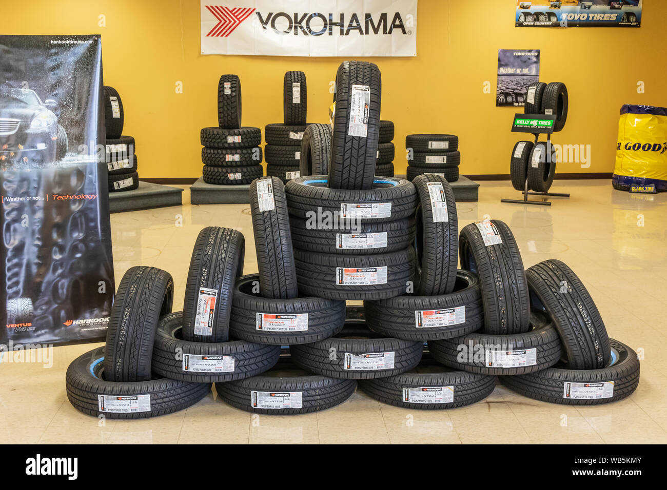 HICKORY, NC, USA-25 JUNE 2018: An interesting display of auto tires, mostly Hankook brand, on the floor of a tire and auto repair shop. Stock Photo