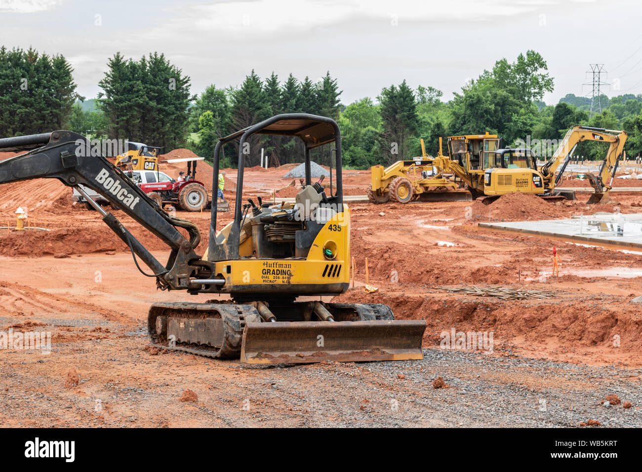 HICKORY, NC, USA-21 MAY 2019: Earth--moving machinery prepares building site for apartment complex. Stock Photo