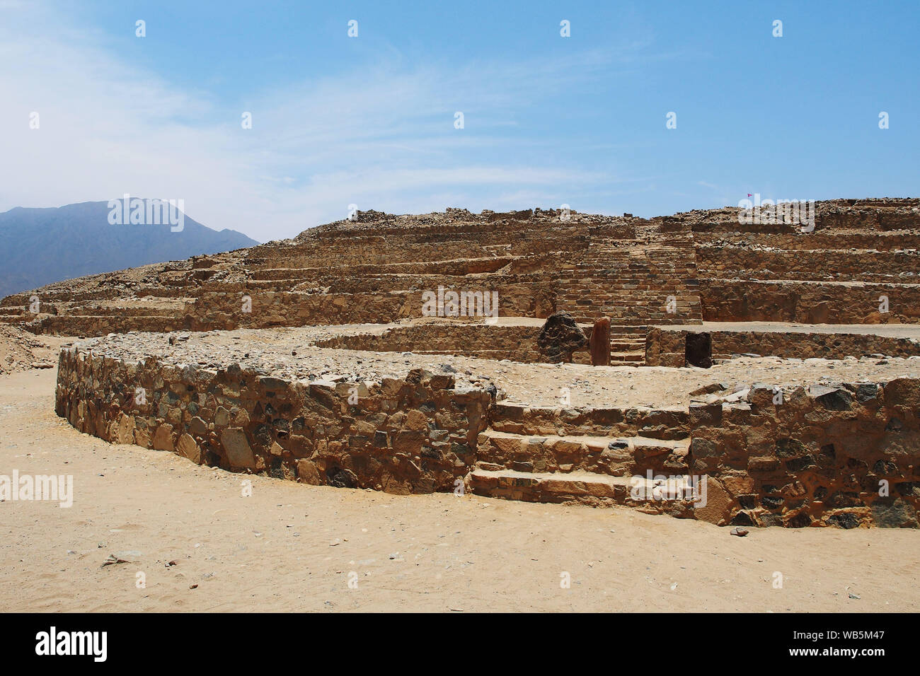 View of a circular plaza of the ancient sacred citadel of Caral. The sacred city of Caral is considered as the oldest civilization in America, its remains date from 3,500 BC. Stock Photo
