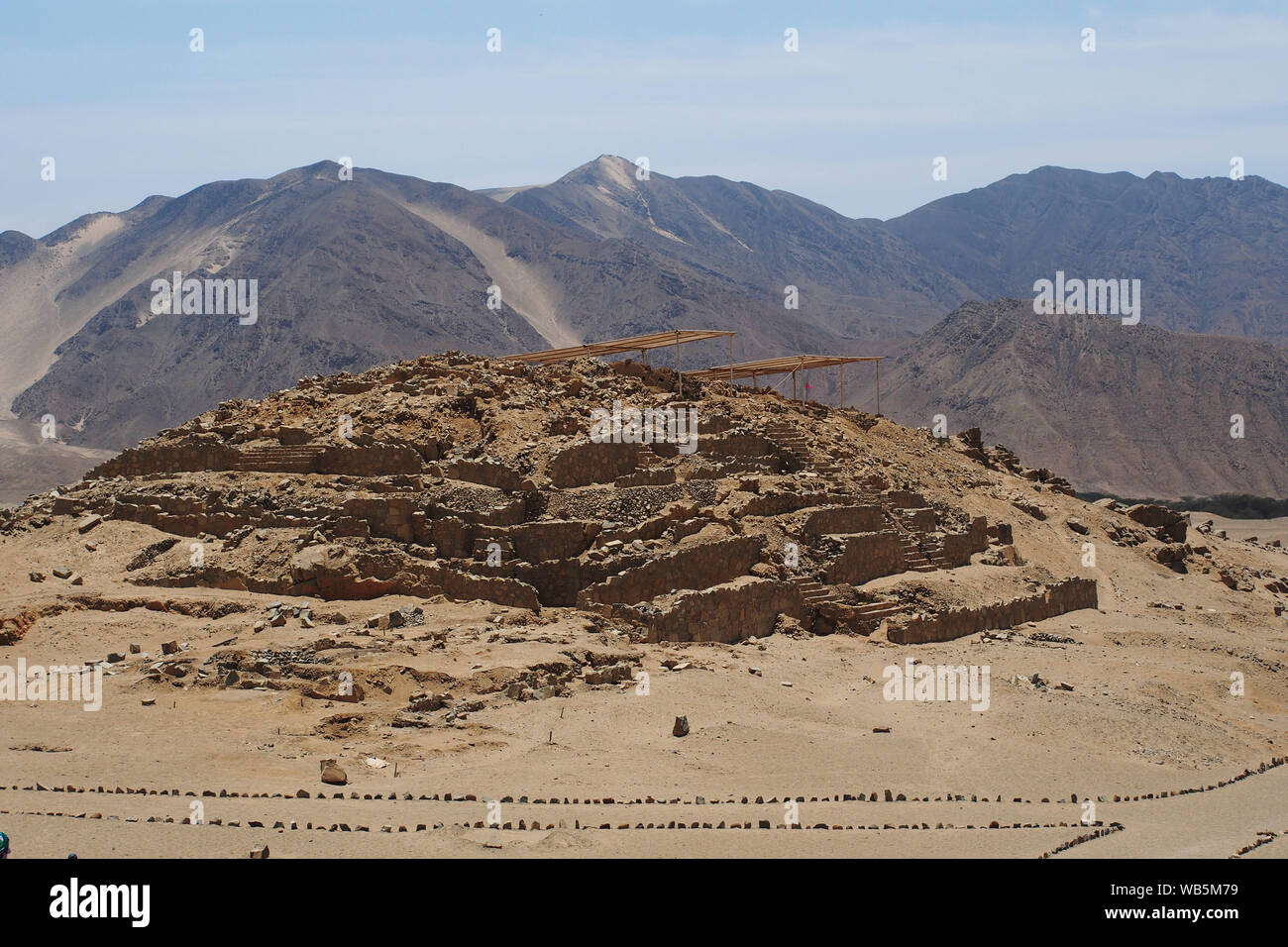 View of a pyramid  of the ancient sacred citadel of Caral. The sacred city of Caral is considered as the oldest civilization in America, its remains date from 3,500 BC. Stock Photo