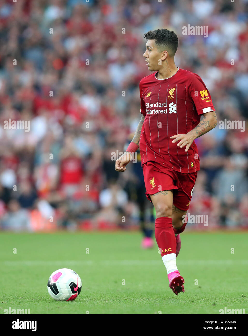 24th August 2019; Anfield, Liverpool, Merseyside, England; English Premier League Football, Liverpool versus Arsenal Football Club; Roberto Firmino of Liverpool looks up for a team mate before making a pass