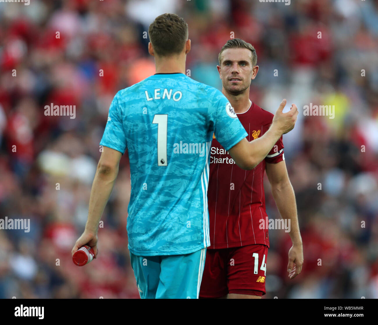 24th August 2019; Anfield, Liverpool, Merseyside, England; English Premier League Football, Liverpool versus Arsenal Football Club; Jordan Henderson of Liverpool shakes hands with Arsenal goalkeeper Bernd Leno after the final whistle - Strictly Editorial Use Only. No use with unauthorized audio, video, data, fixture lists, club/league logos or 'live' services. Online in-match use limited to 120 images, no video emulation. No use in betting, games or single club/league/player publications - Strictly Editorial Use Only. No use with unauthorized audio, video, data, fixture lists, club/league logo Stock Photo