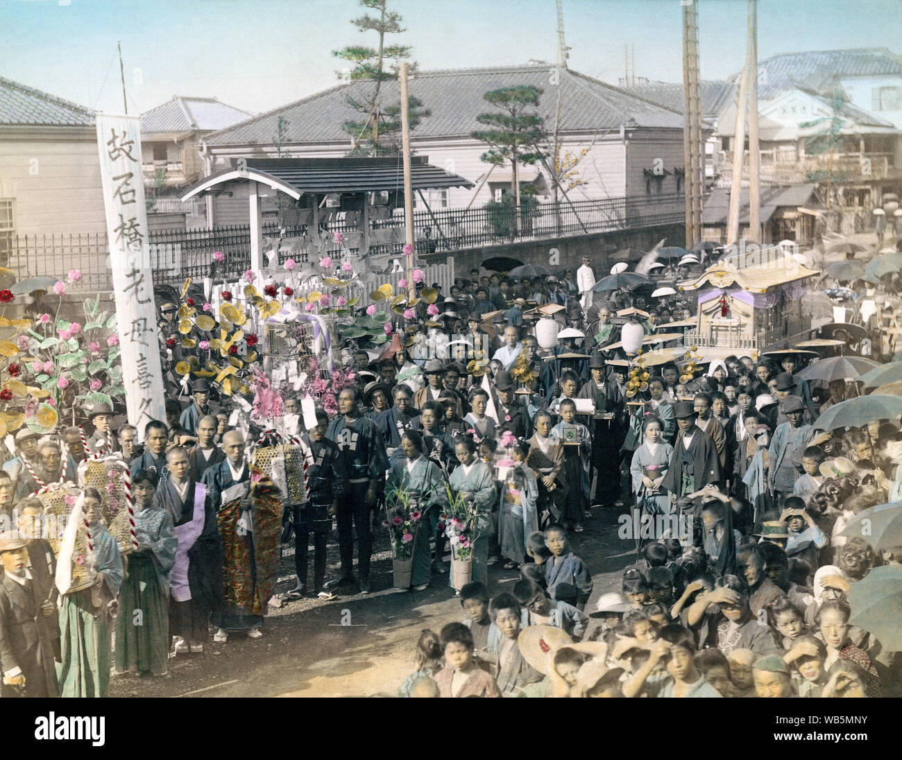 [ 1890s Japan - Japanese Funeral Procession ] —   A funeral procession. The mourners carry large clusters of artificial flowers.  19th century vintage albumen photograph. Stock Photo