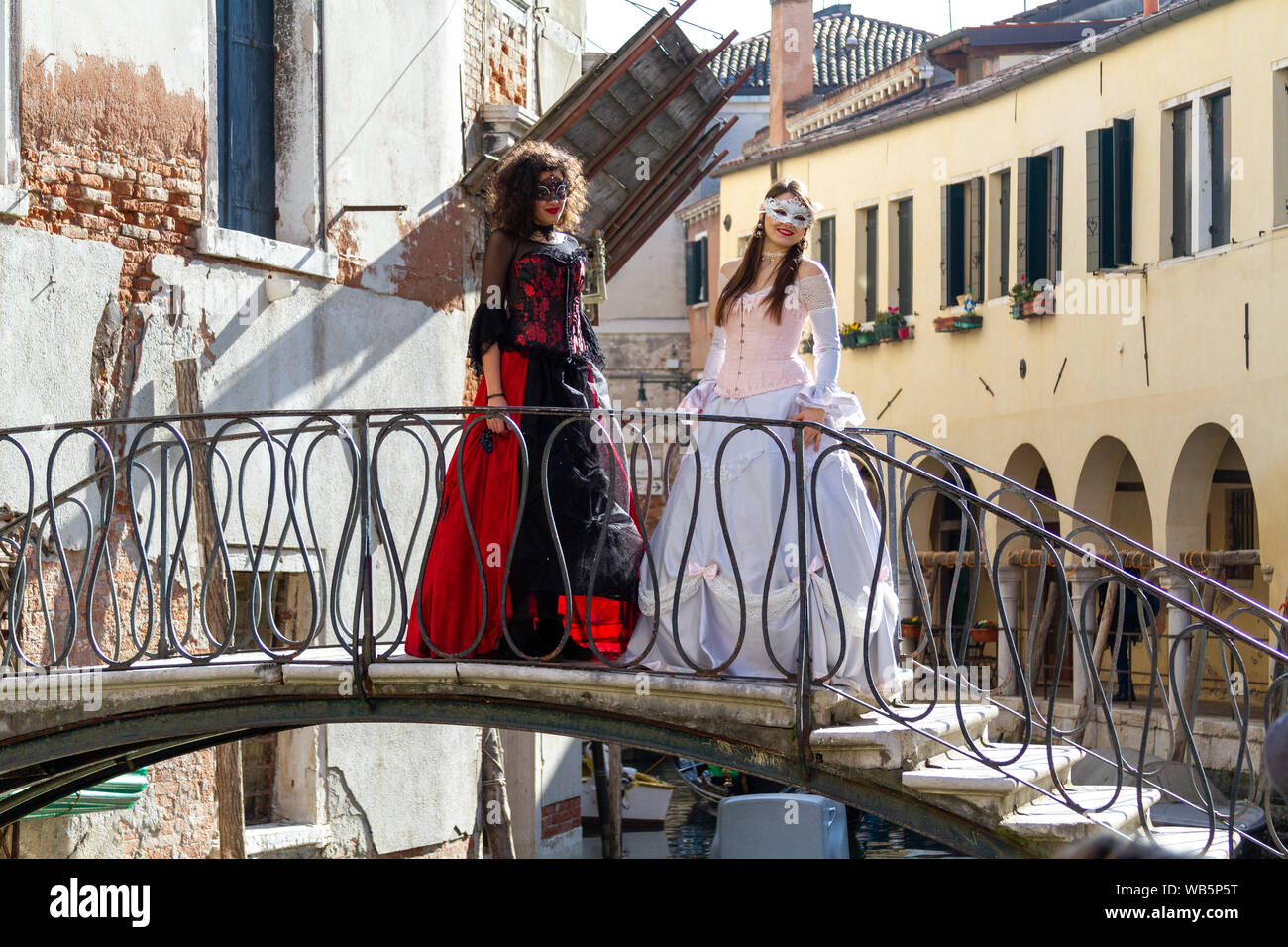 Two women in masks during Carnival in Venice. Stock Photo