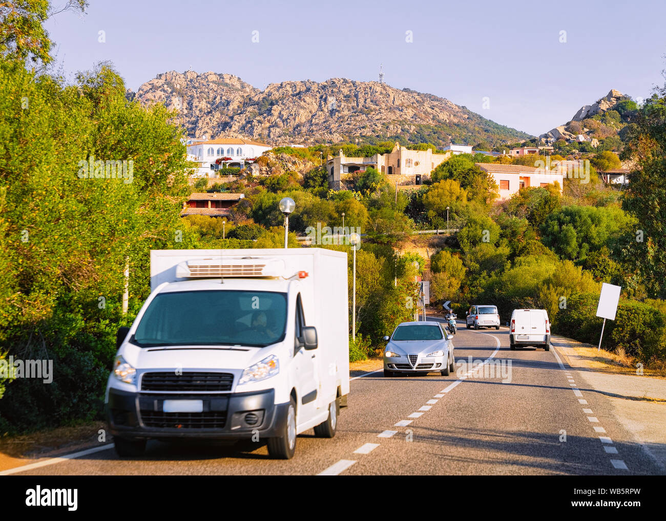 Rv cavaran and cars on the road in Costa Smeralda on Sardinia Island in