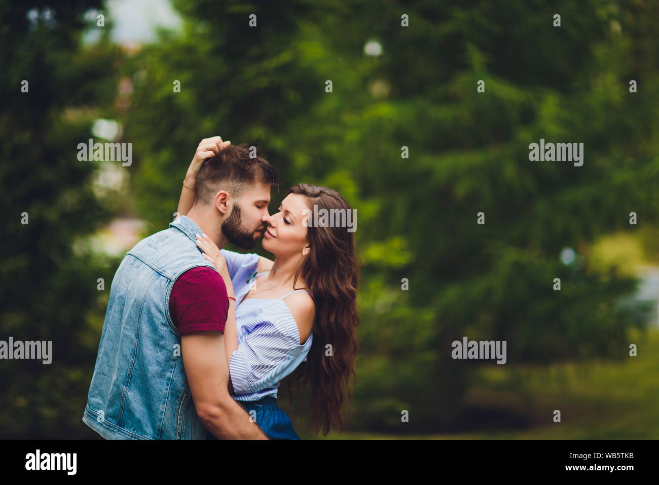 Cheerful young couple having fun and laughing together outdoors Stock ...