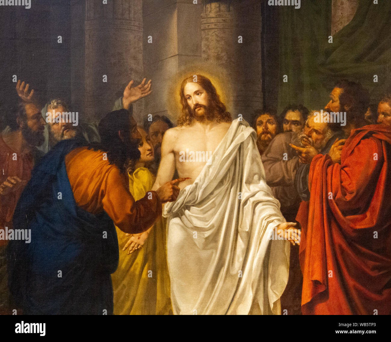 The painting of Resurrected Jesus Christ with Thomas the apostle and other apostles by Sebastiano Santi in 'Chiesa dei Santi Apostoli' church. Stock Photo