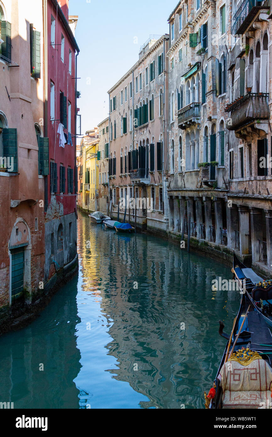 Gondolas and boats on the rivers of Venice Stock Photo - Alamy