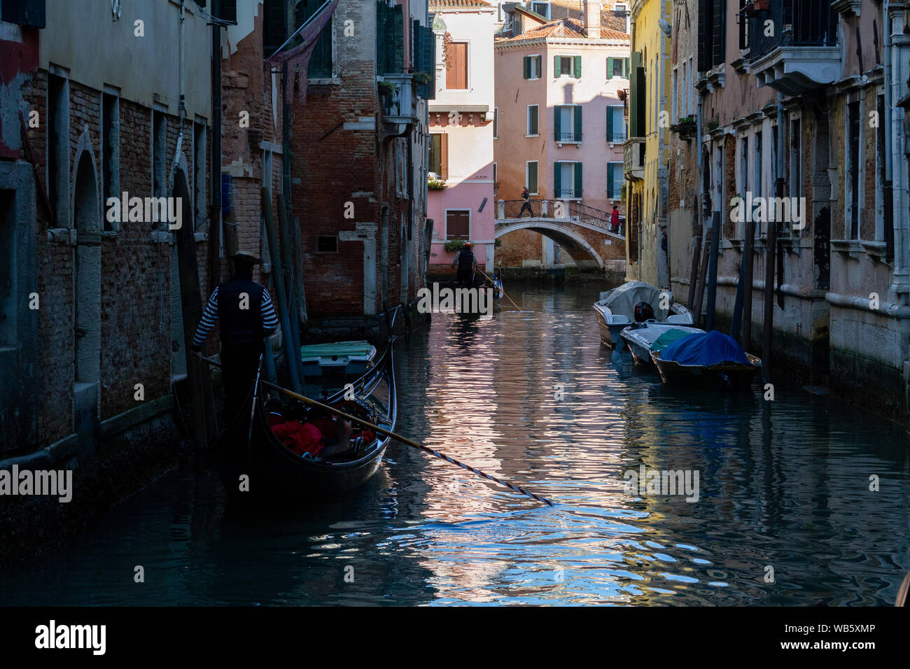 Gondolas and boats on the rivers of Venice Stock Photo - Alamy