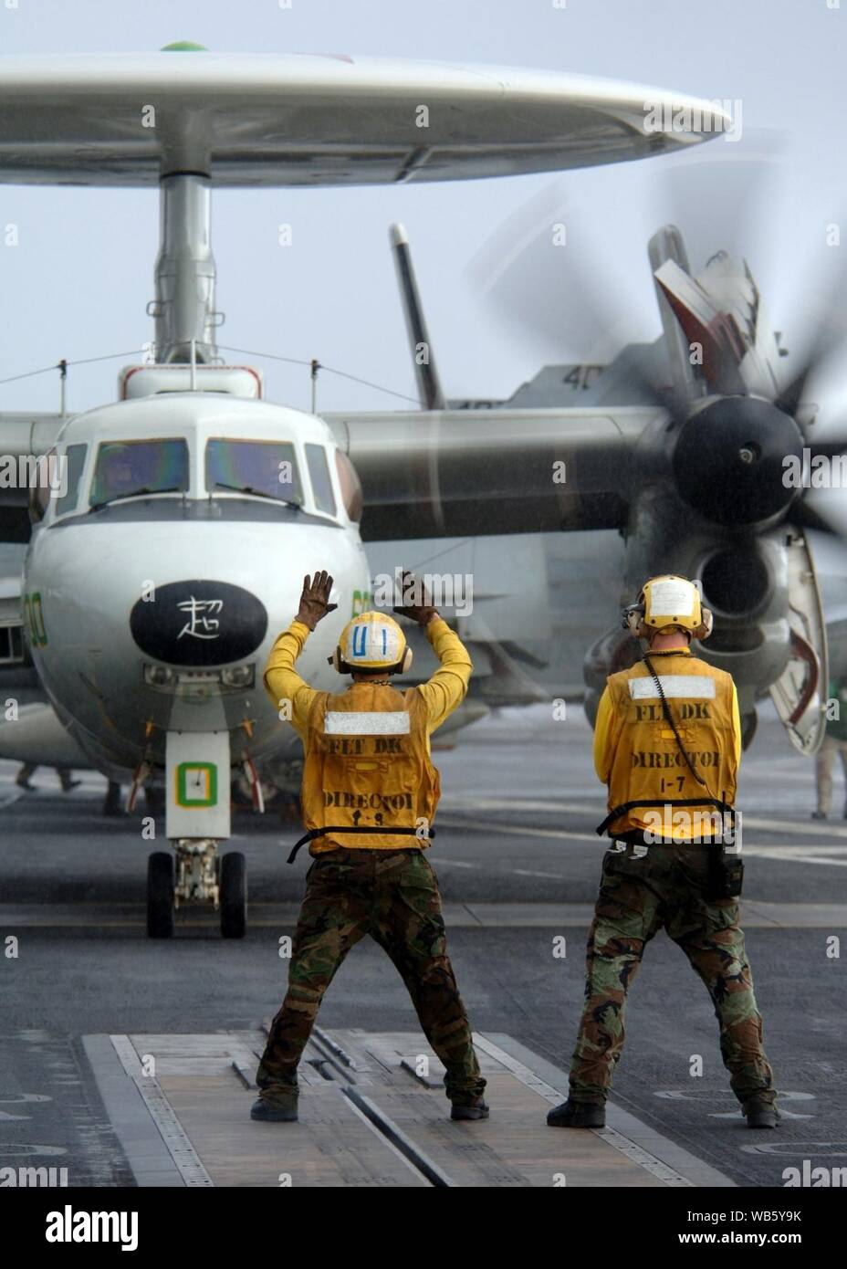 E-2C Hawkeye aircraft assigned to Airborne Early Warning Squadron 115 approaches a catapult on the flight deck of the aircraft carrier USS George Washington (CVN 73). Stock Photo