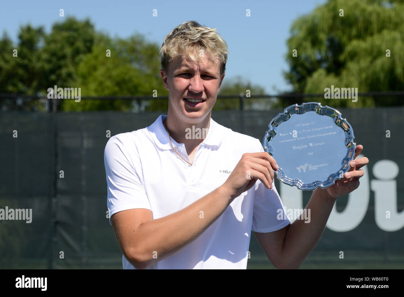 College Park, Maryland, USA. 24th Aug, 2019. Karlis Ozolins of Latvia with  his trophy after winning the Wayne K. Curry Prince George's County  International Junior Tennis Championships in College Park Maryland. Credit: