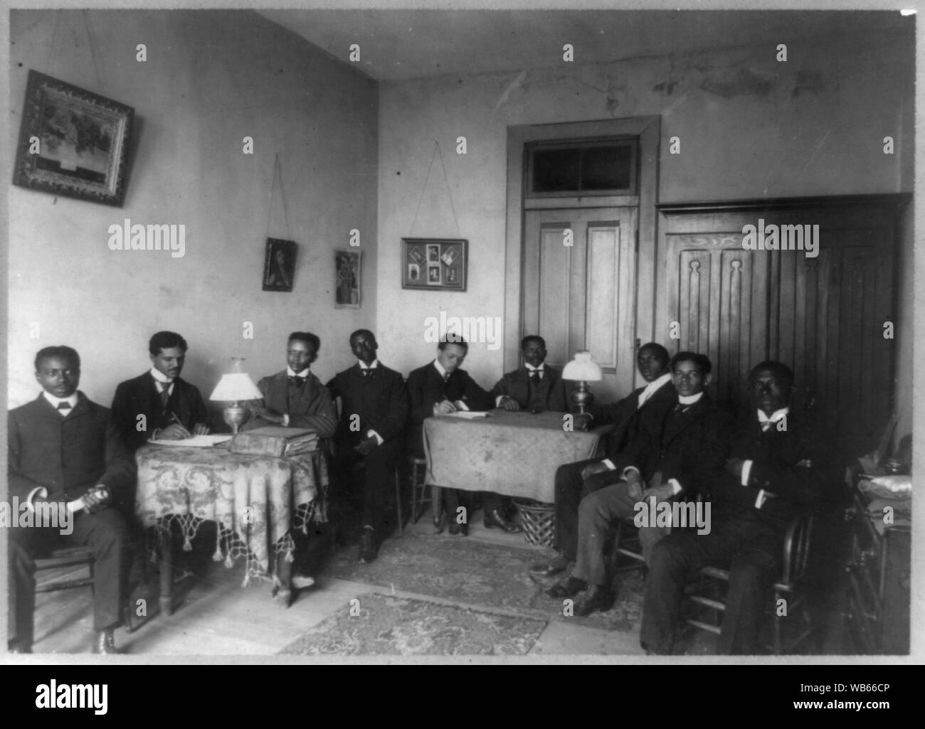 Nine men seated around hi-res stock photography and images - Alamy