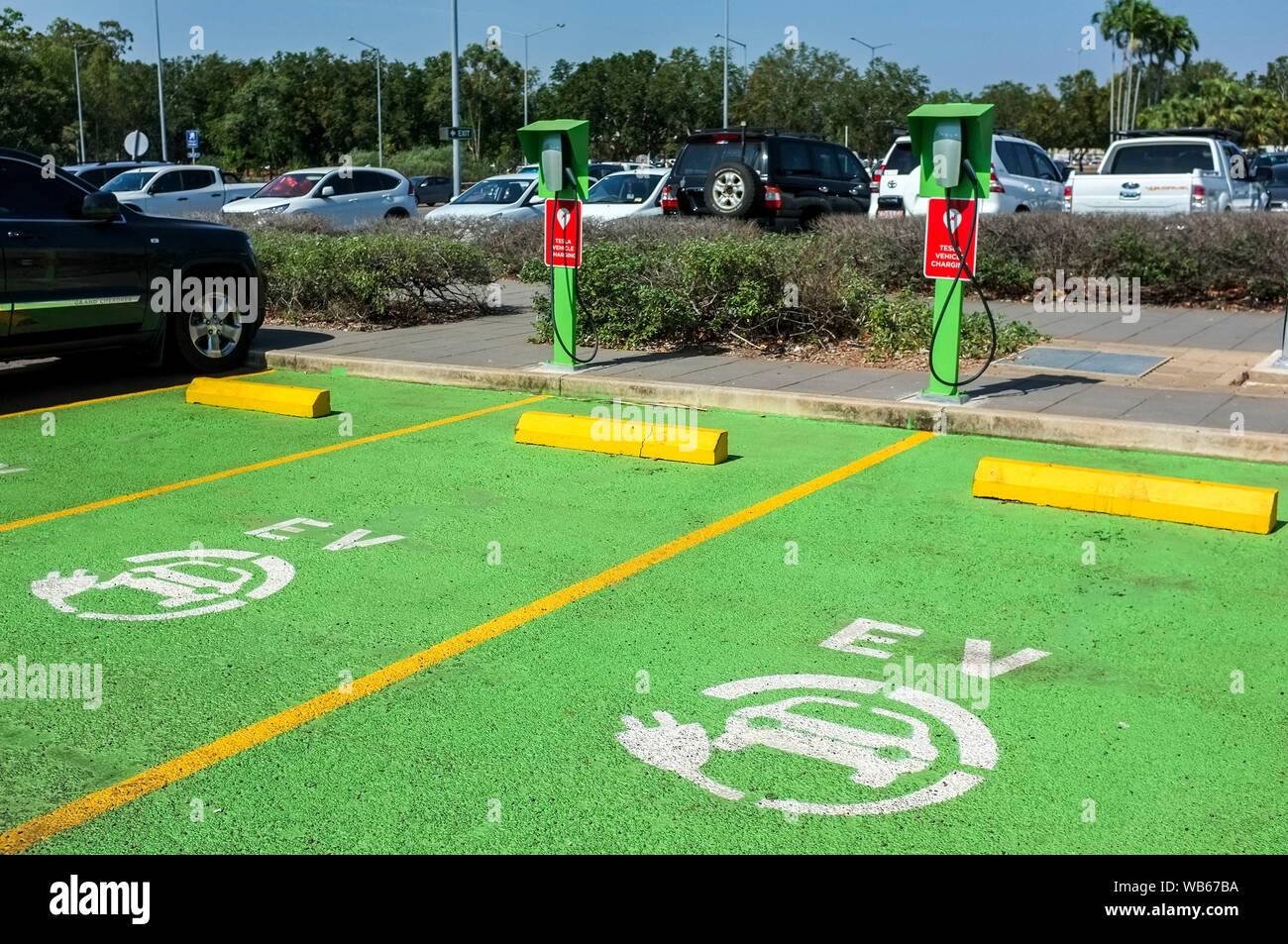 Tesla electric vehicule chargers at the Darwin International Airport in Darwin, Northern Territory Australia. Stock Photo