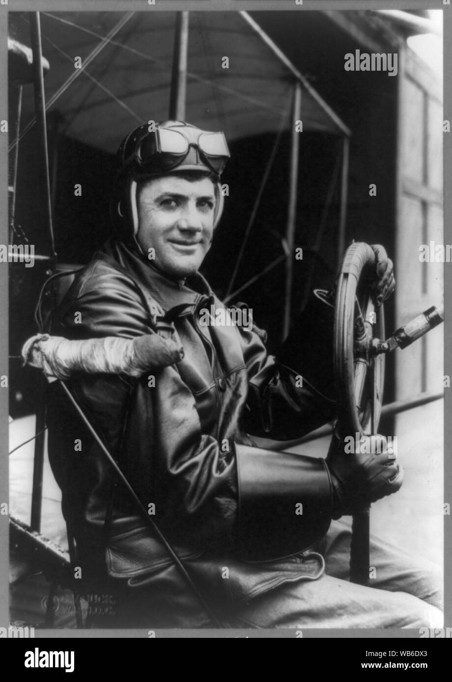 F.B. Hennessy, Army aviator, three-quarter length portrait, seated at steering wheel of airplane, facing right, in aviator's clothes Abstract/medium: 1 photographic print. Stock Photo