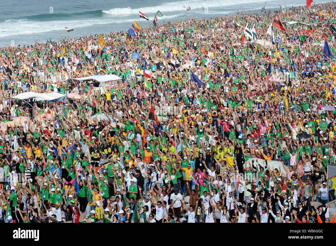 Rio de Janeiro, July 28, 2013. Public of believers make flash mob during World Youth Day on the beach in Copacabana, Brazil Stock Photo