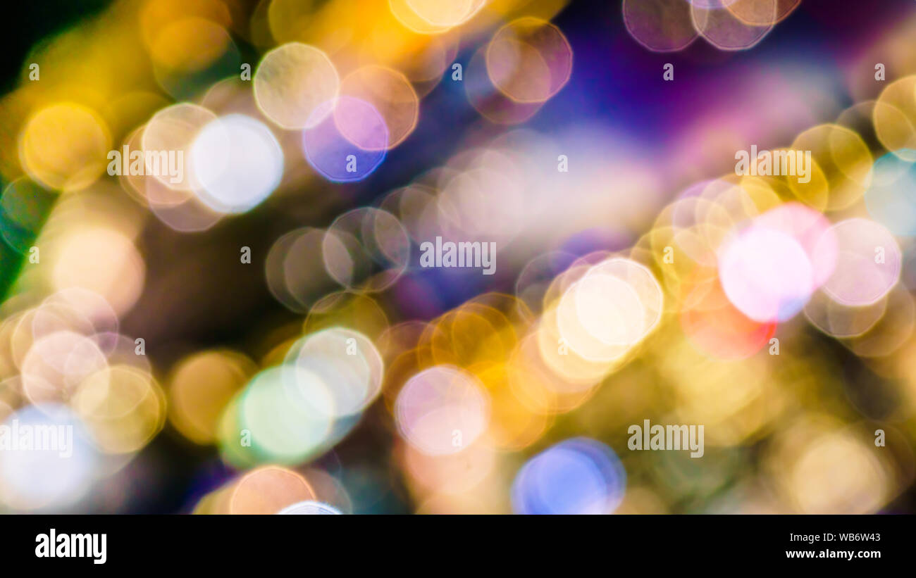 The colourful lights of city buildings take on a festive appearance when seen as defocused orbs. Stock Photo
