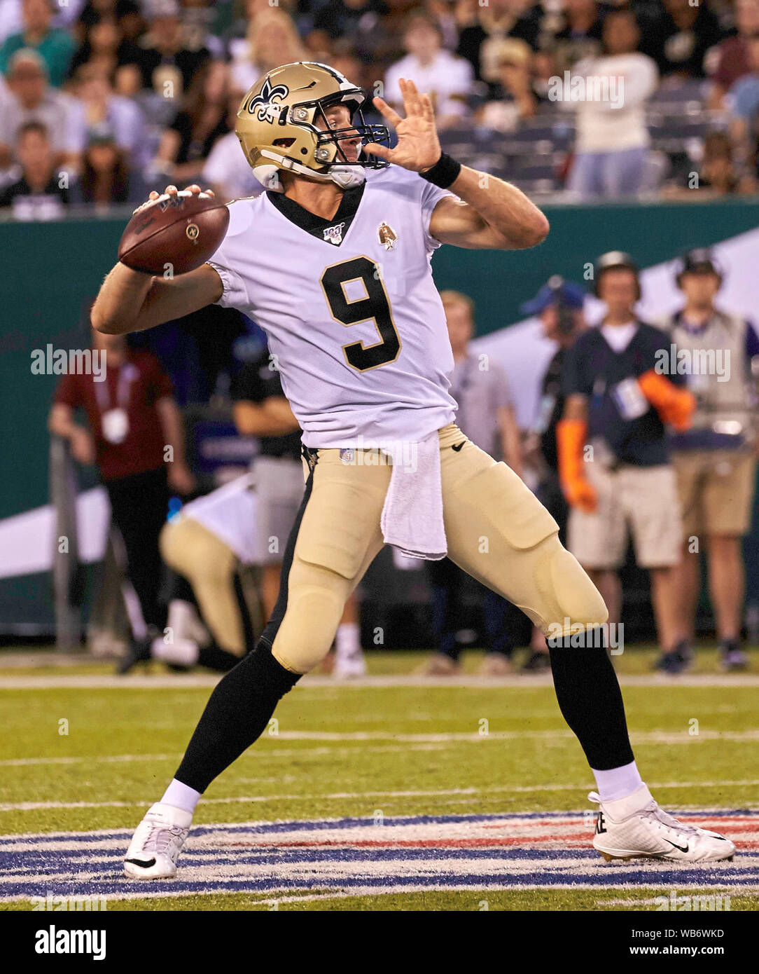 New Orleans Saints Drew Brees stretches on the sidelines before the game  against the New York Giants in week 4 of the NFL season at MetLife Stadium  in East Rutherford, New Jersey