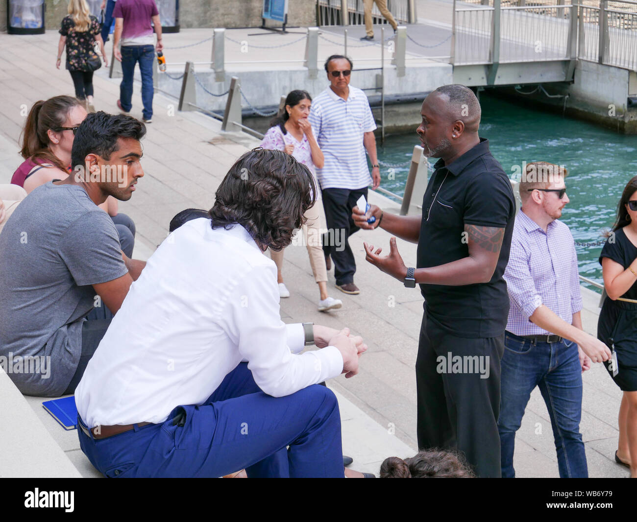 People conversing. Chicago Riverwalk. Stock Photo