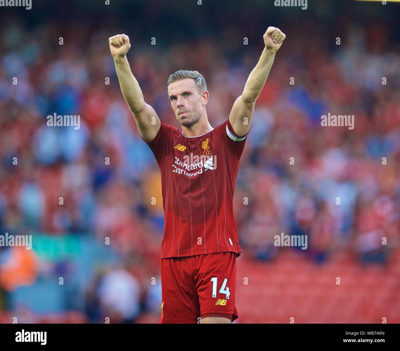 Liverpool. 25th Aug, 2019. Liverpool's captain Jordan Henderson celebrates after the English Premier League match between Liverpool FC and Arsenal FC at Anfield in Liverpool, Britain on Aug. 24, 2019. Credit: Xinhua/Alamy Live News Stock Photo