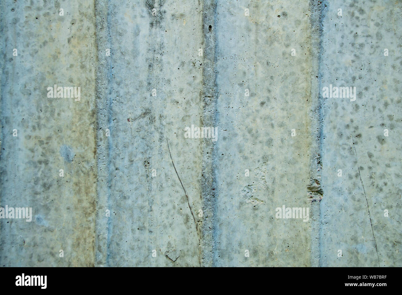 The texture of the concrete wall with a wavy structure. Background. Stock Photo