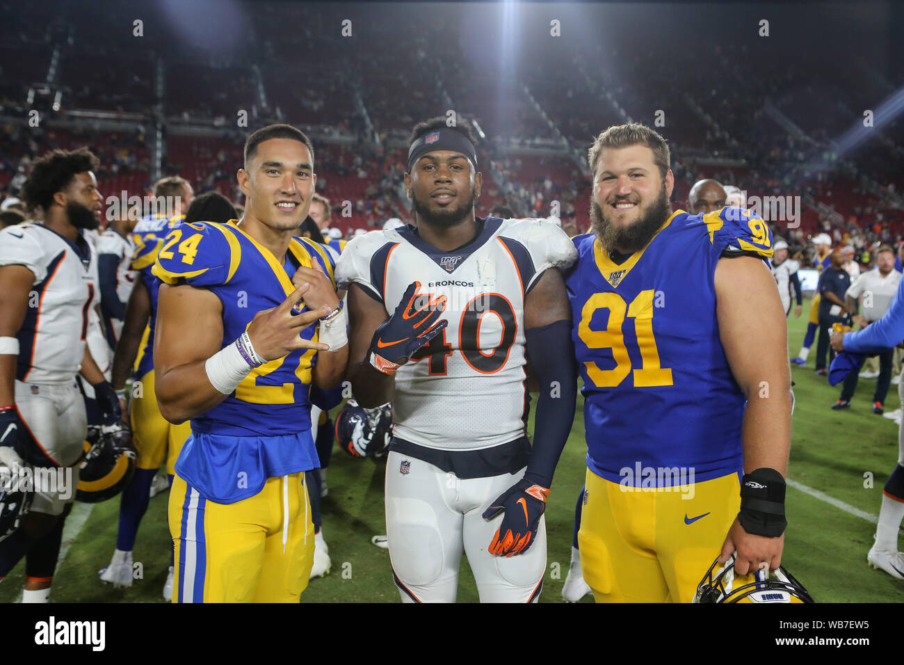 Los Angeles, CA., USA. 24th August, 2019. Los Angeles Rams safety Taylor Rapp #24, Denver Broncos linebacker Keishawn Bierria #40, and Los Angeles Rams defensive tackle Greg Gaines #91 after the NFL game between Denver Broncos vs Los Angeles Rams at the Los Angeles Memorial Coliseum in Los Angeles, Ca on August 24, 2019. Jevone Moore Credit: Cal Sport Media/Alamy Live News Stock Photo
