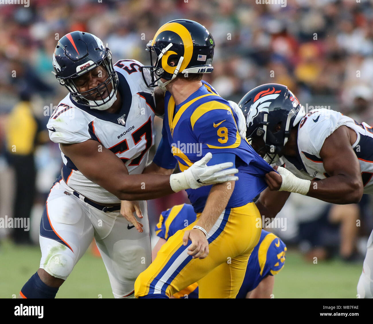 Los Angeles, CA., USA. 24th August, 2019. Denver Broncos defensive end DeMarcus Walker #57 just late to Los Angeles Rams quarterback John Wolford #9 during the NFL game between Denver Broncos vs Los Angeles Rams at the Los Angeles Memorial Coliseum in Los Angeles, Ca on August 24, 2019. Jevone Moore Credit: Cal Sport Media/Alamy Live News Stock Photo