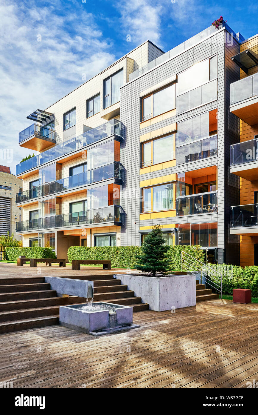 Modern complex of apartment residential buildings. With staircase, fountain and other outdoor facilities. Stock Photo