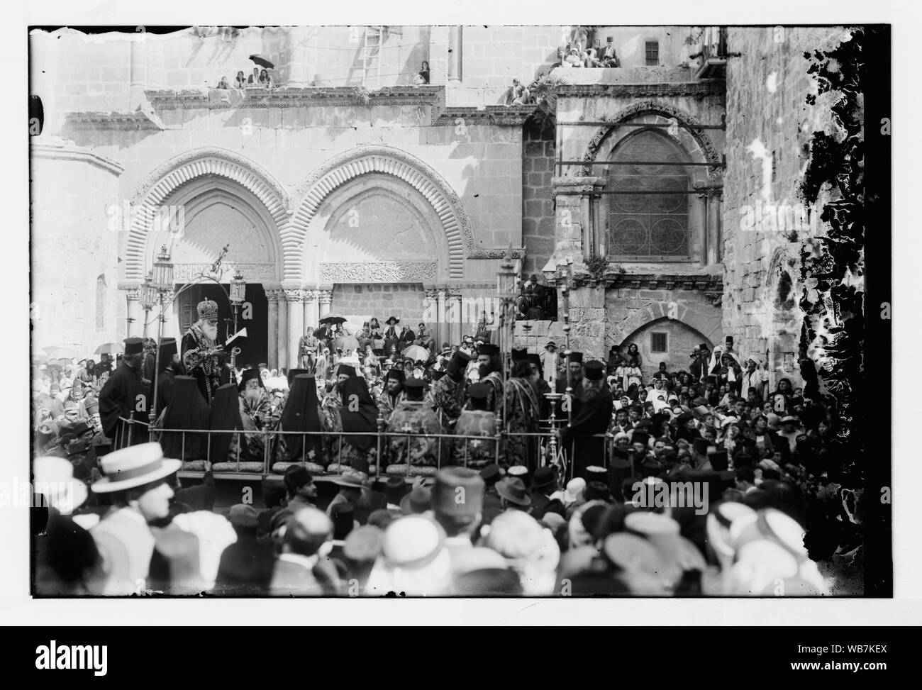 Foot washing ceremony, possibly with Syrian Orthodox patriarch, outside the Church of the Holy Sepulchre, Jerusalem Abstract/medium: G. Eric and Edith Matson Photograph Collection Stock Photo
