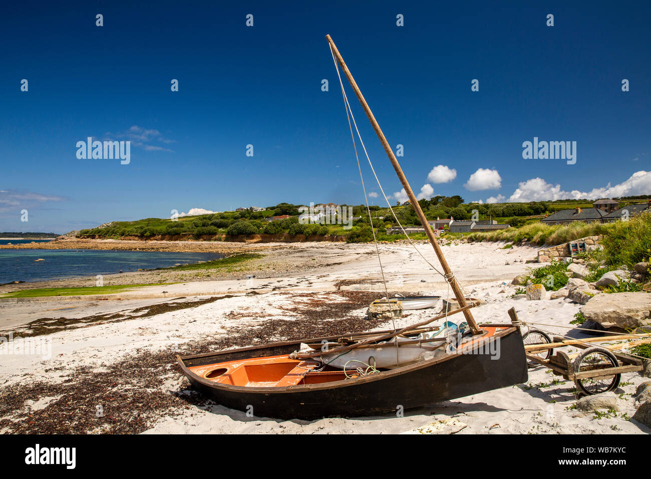UK, England, Scilly Islands, St Mary’s, Porthloo, sailing boat on beach above high tide line on sunny summer day Stock Photo
